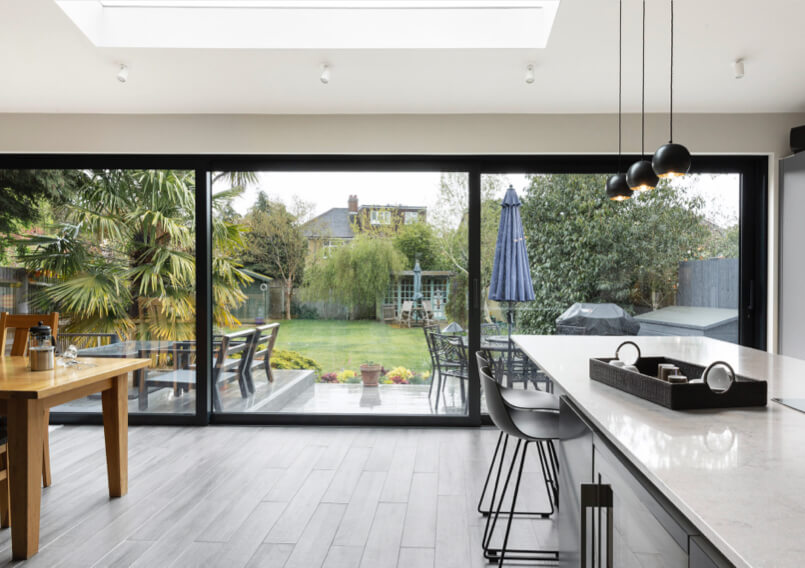 spacious remodelled kitchen in Surbiton, with full height bifold glass doors and skylight